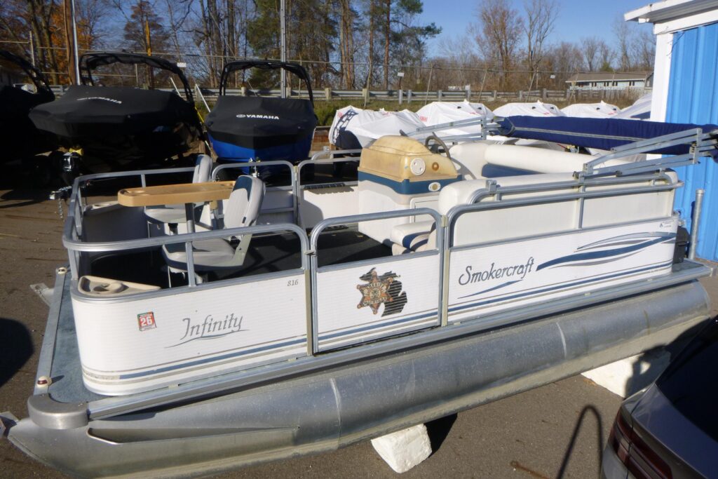 2003 Smoker Craft 816 Infinity Fish pontoon boat on trailer outdoors