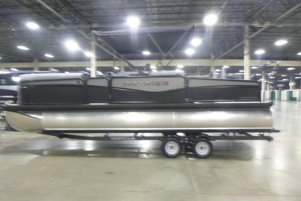 2026 Premier 230 SunSation RS pontoon boat displayed indoors with bimini top