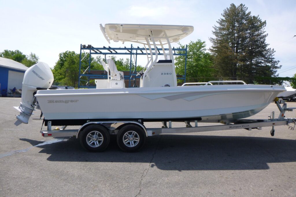 2024 Ranger 2360 Bay center console boat on trailer with white hull, T-top, and Mercury outboard motor