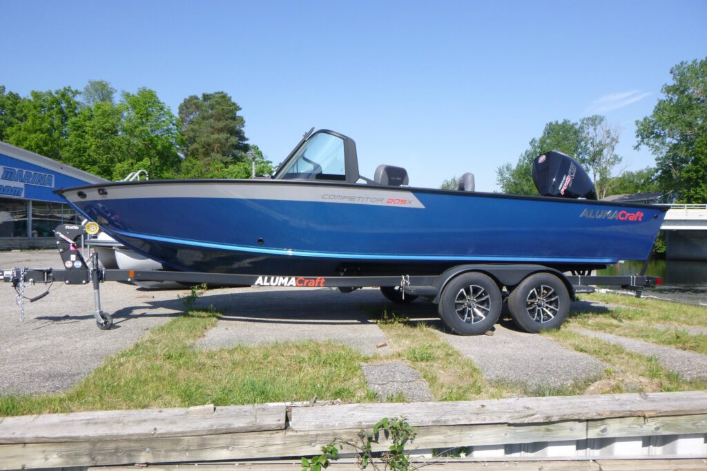 2026 Alumacraft Competitor 205 Sport fishing boat with outboard on trailer at Grand Pointe Marina