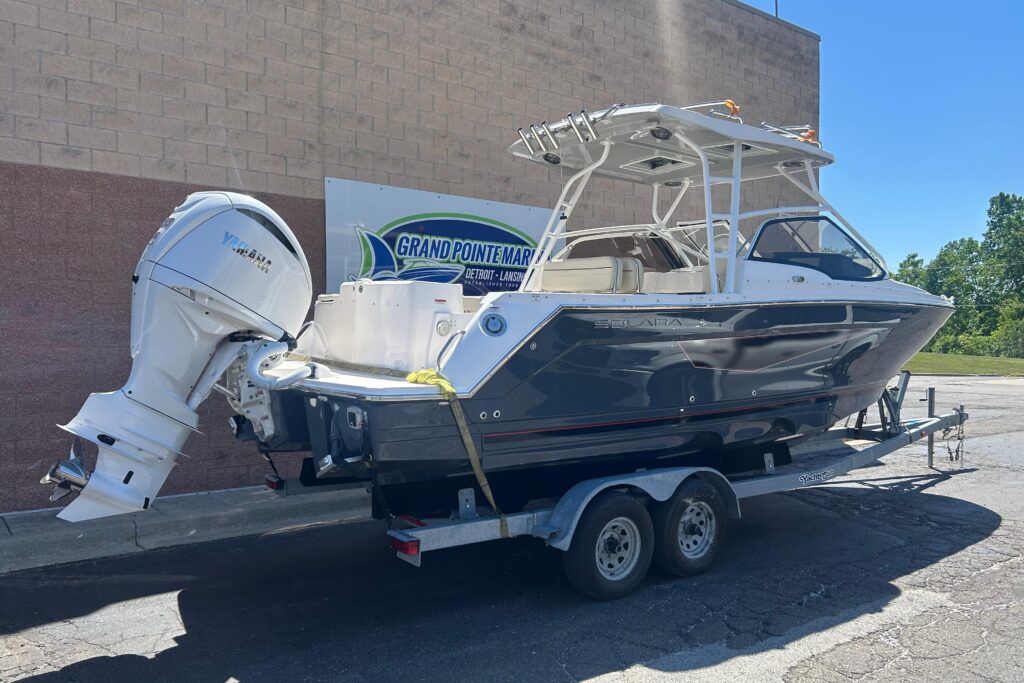 2026 Solara S-250 DC dual console boat with Yamaha outboard on trailer at Grand Pointe Marina