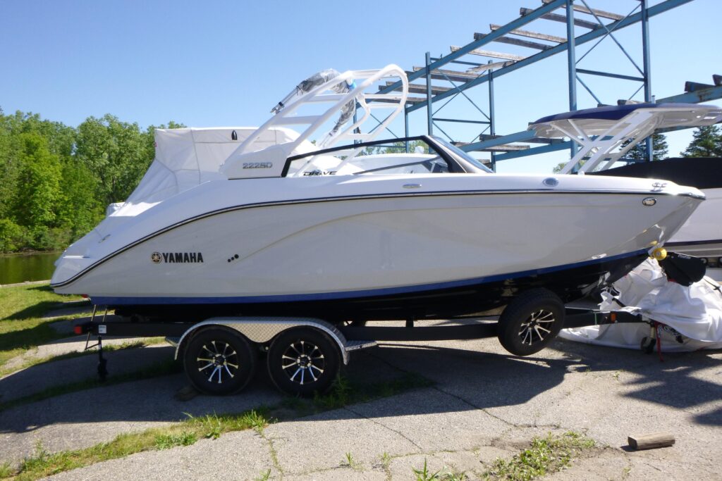 2026 Yamaha 222SD jet boat with white wakeboard tower on trailer at Grand Pointe Marina