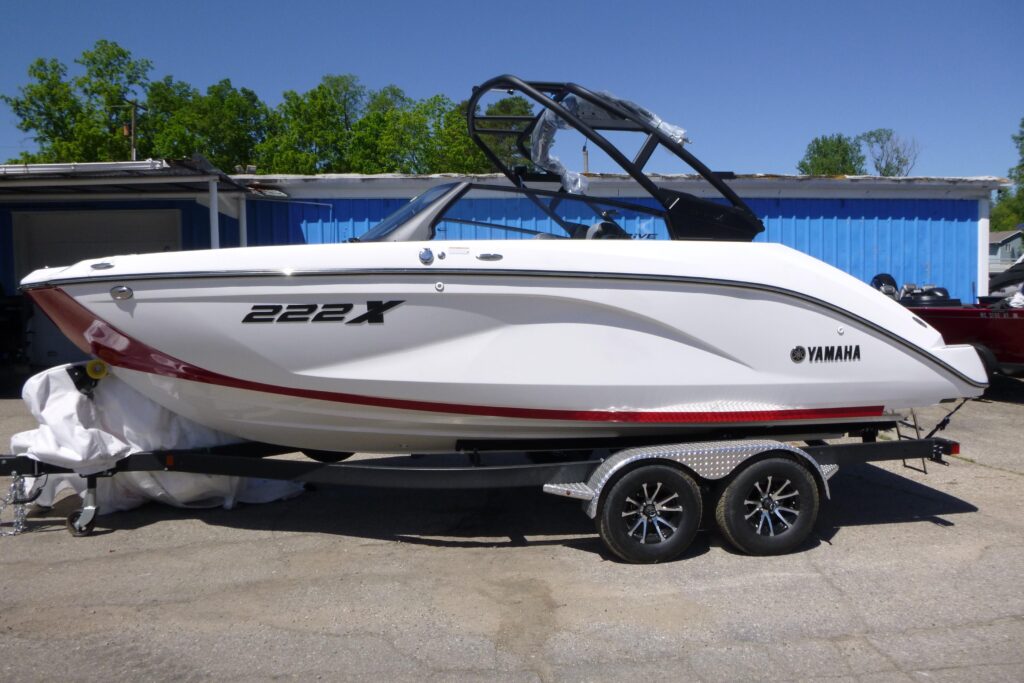 2026 Yamaha 222XD jet boat with black wakeboard tower on trailer at Grand Pointe Marina