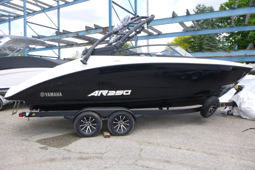 2026 Yamaha AR250 jet boat with wakeboard tower on trailer at Grand Pointe Marina